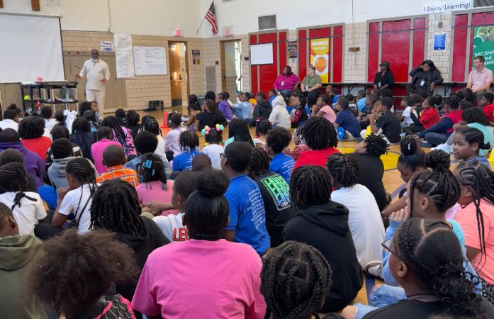  Gym filled with students hearing about how important Count Day is as a school.